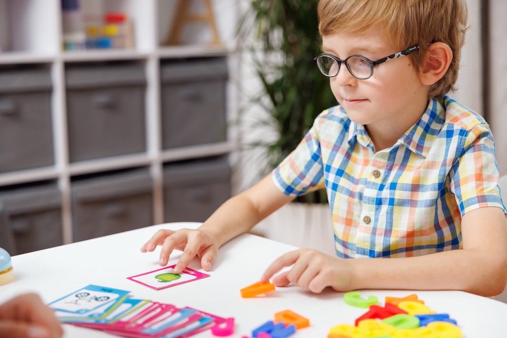 parent and adolescent working together with a Phoenix Autism Center therapist